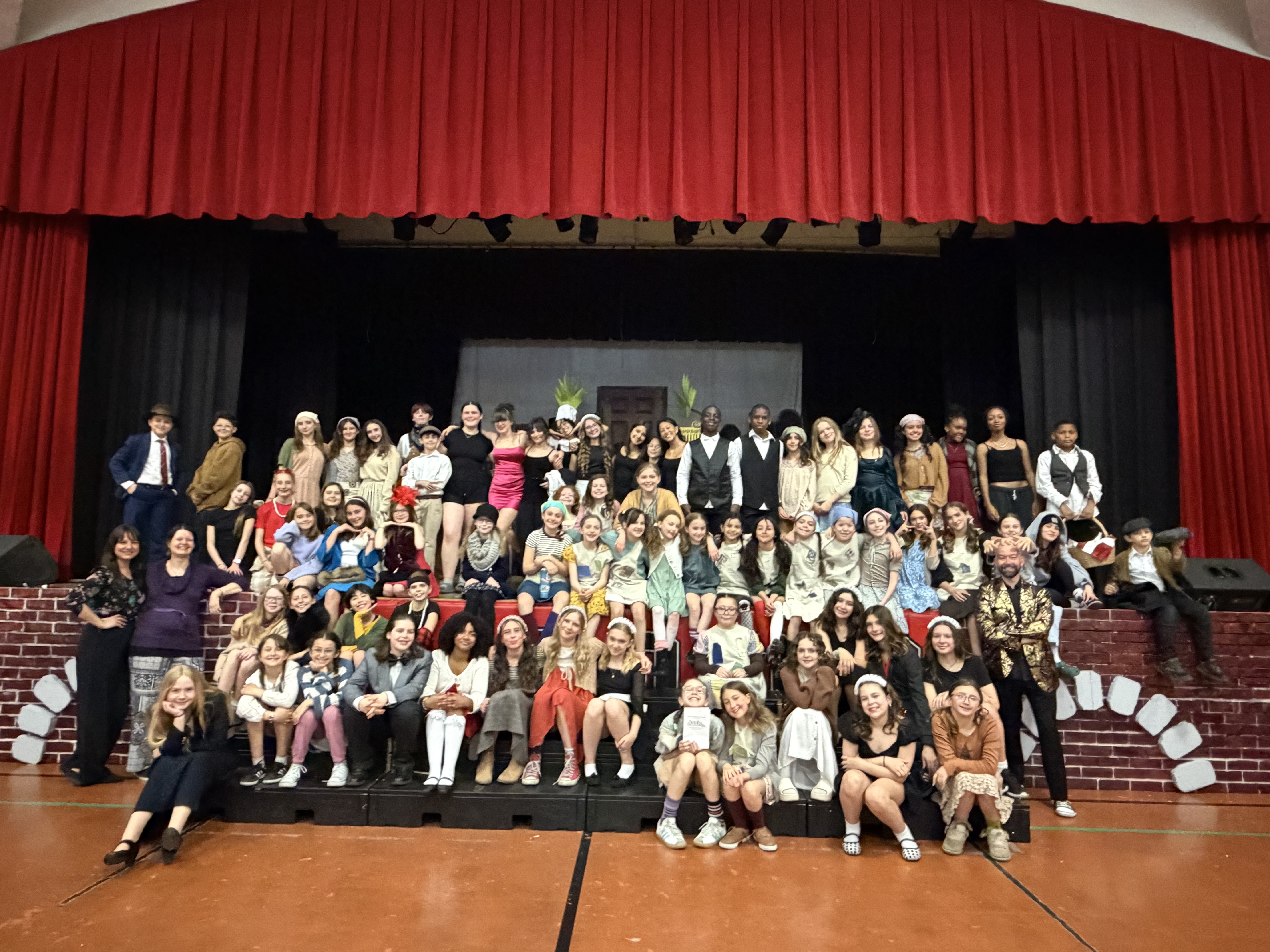 The full company on stage during the finale