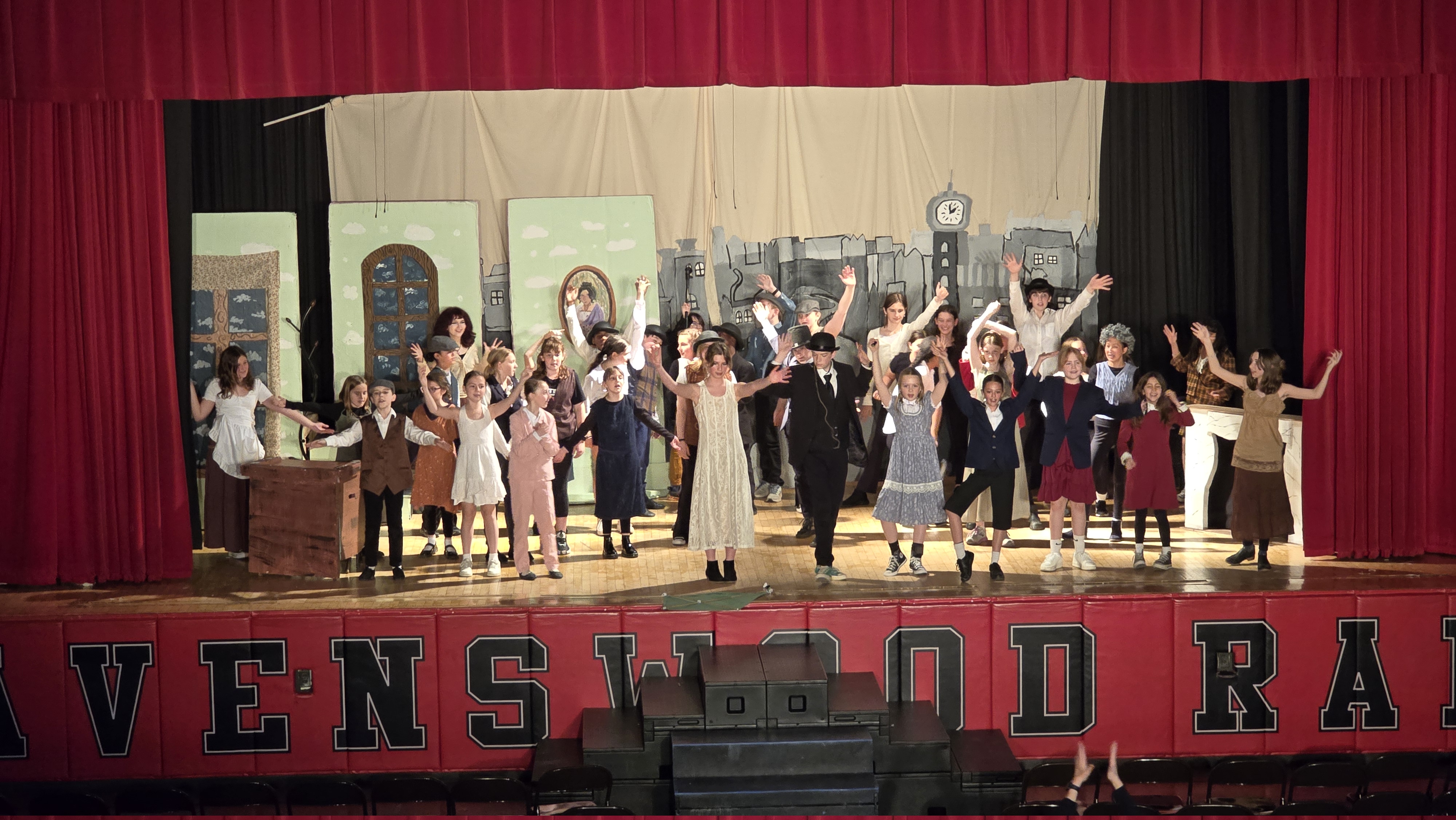 The full company on stage during the finale