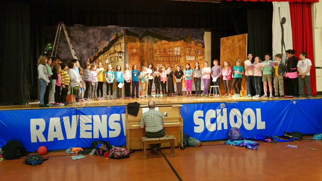 The full company on stage during the finale