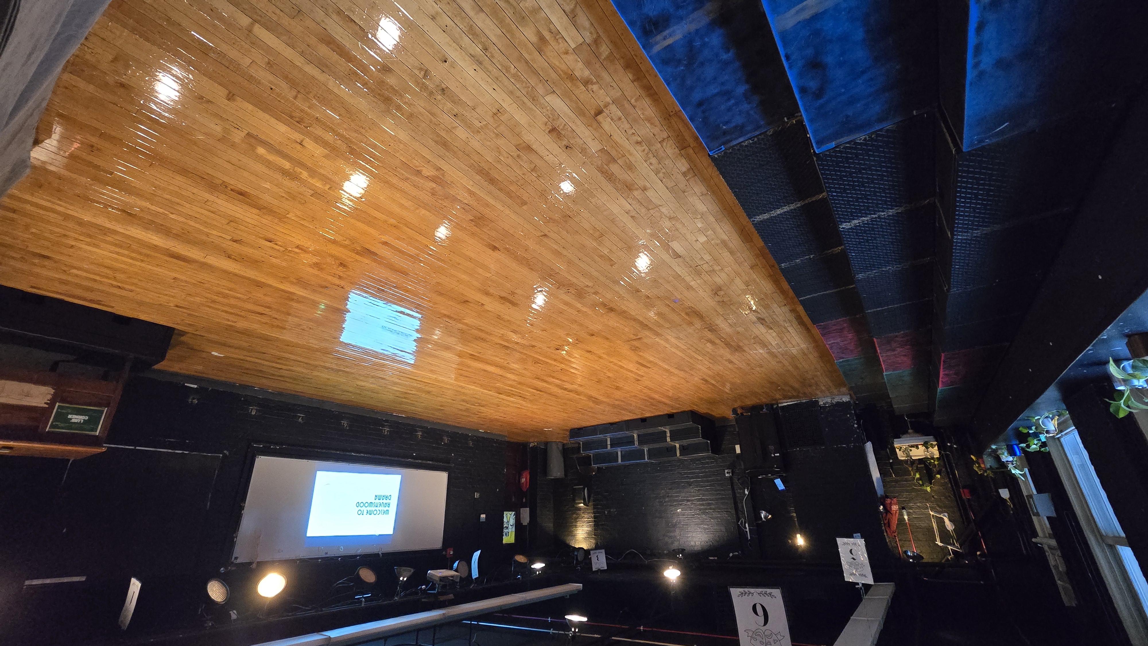 The drama room, empty, looking toward the risers